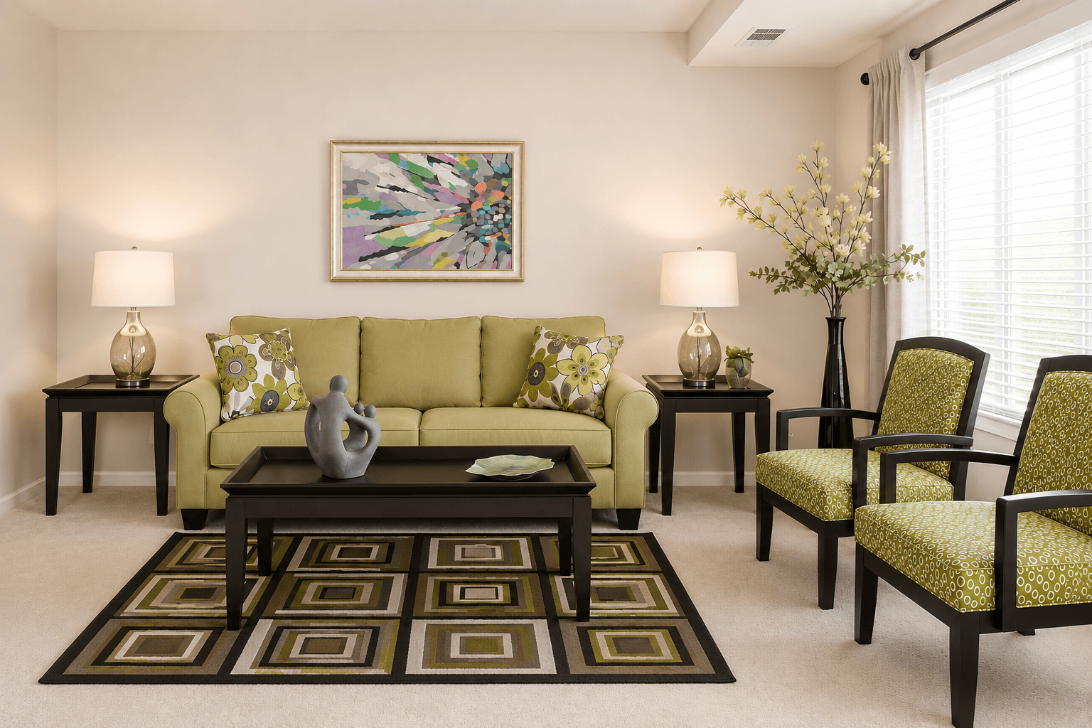 A living room with a green couch, two end tables, a coffee table, and a painting on the wall.